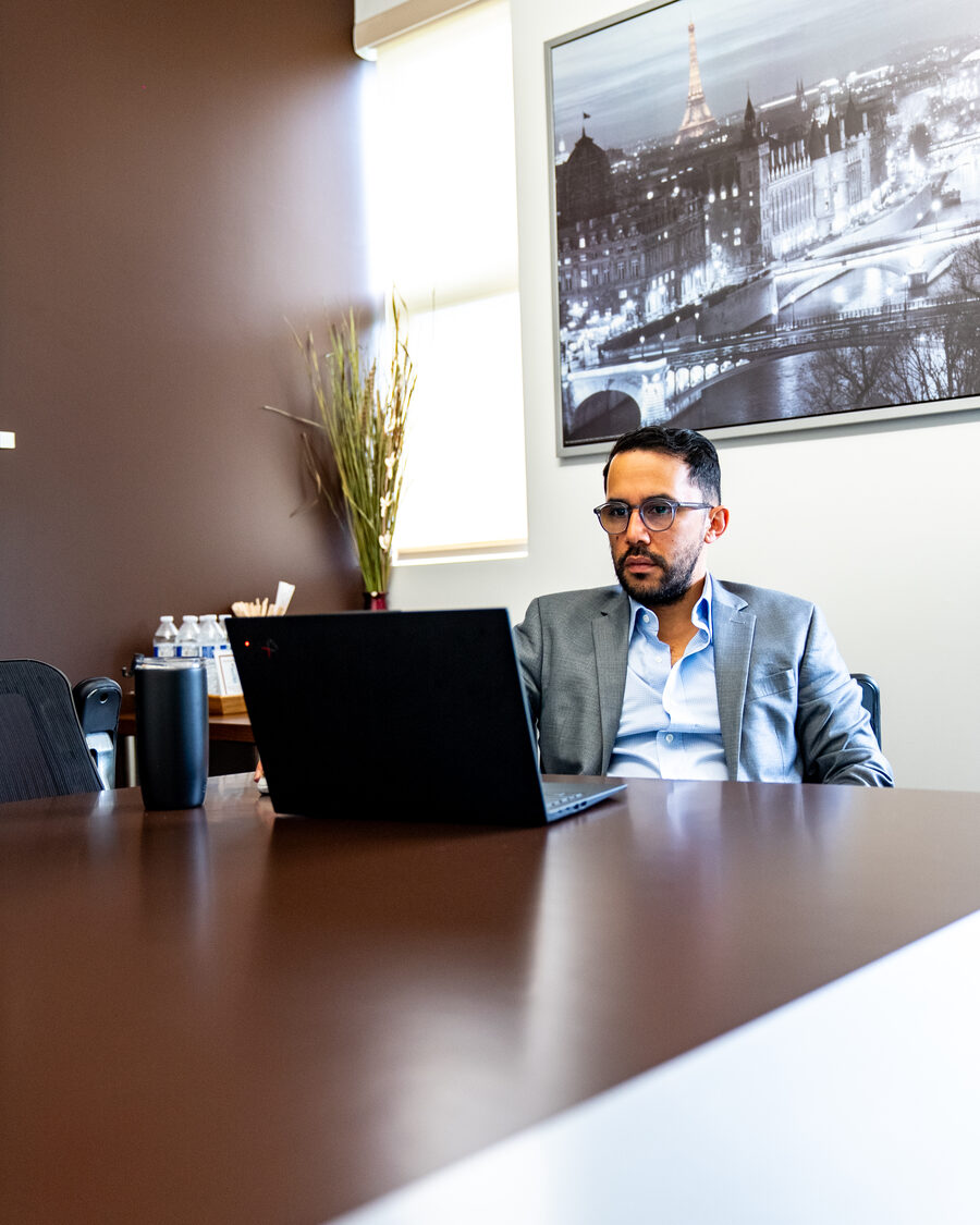 Javier Sanchez, CPA, working at his laptop in the Accountilytics conference room